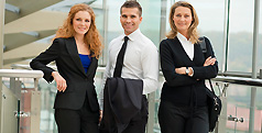 Business professionals standing in a modern office