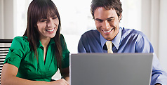 Colleagues working together at a laptop